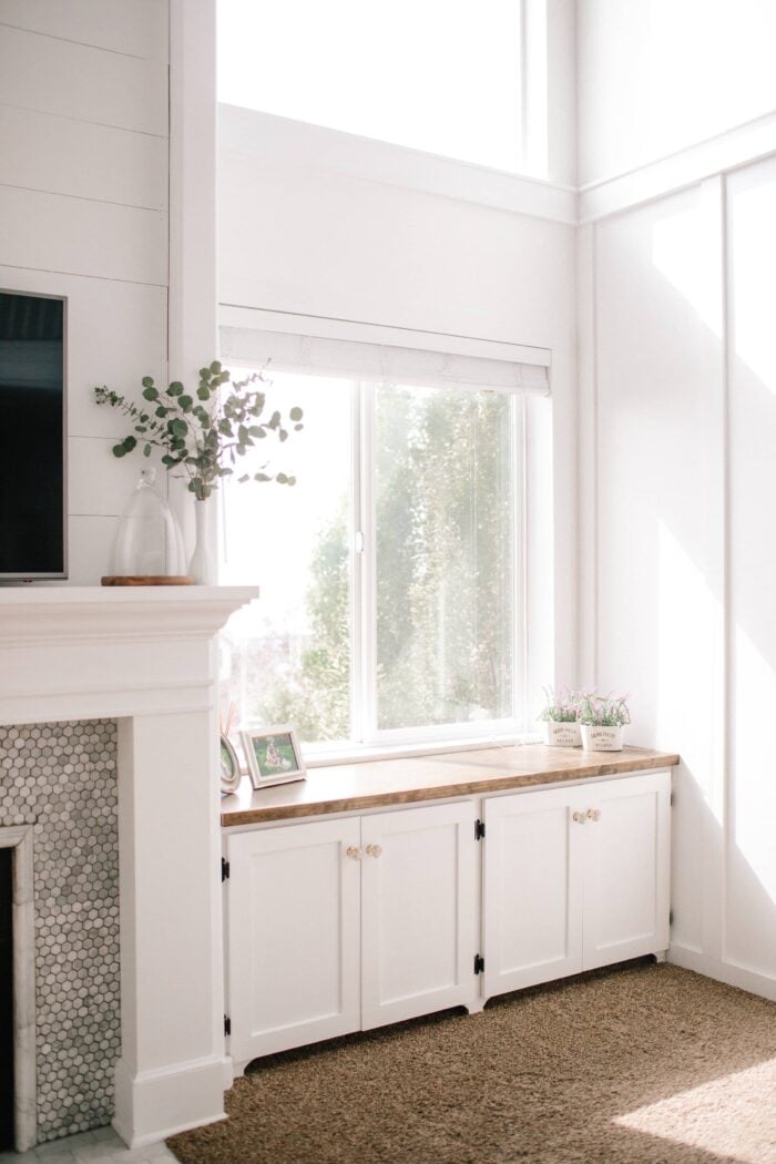 White Mantle with Shiplap and built in cabinets