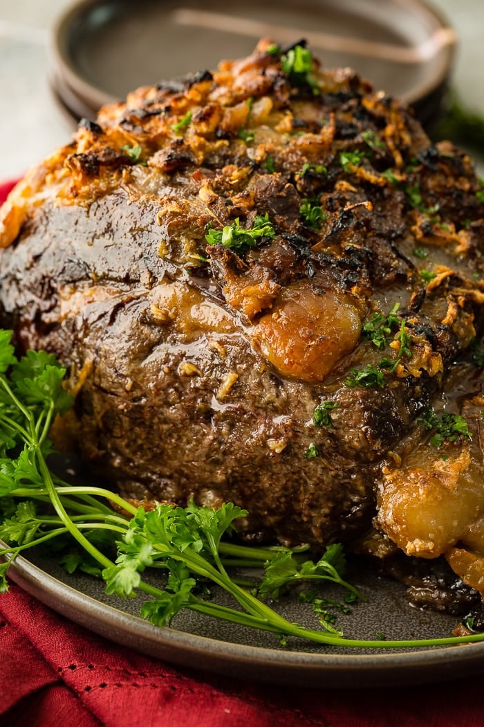a whole roasted prime rib with a garlic butter crust on the outside