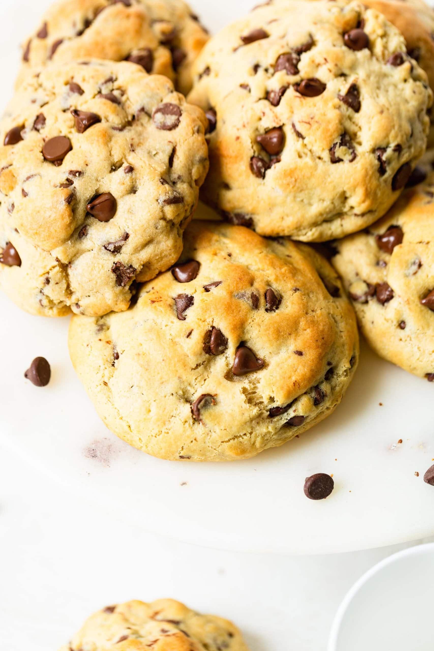 Levain Bakery Style Thick Chocolate Chip Cookies Recipe a photo of a pile of thick golden chocolate chip cookies.