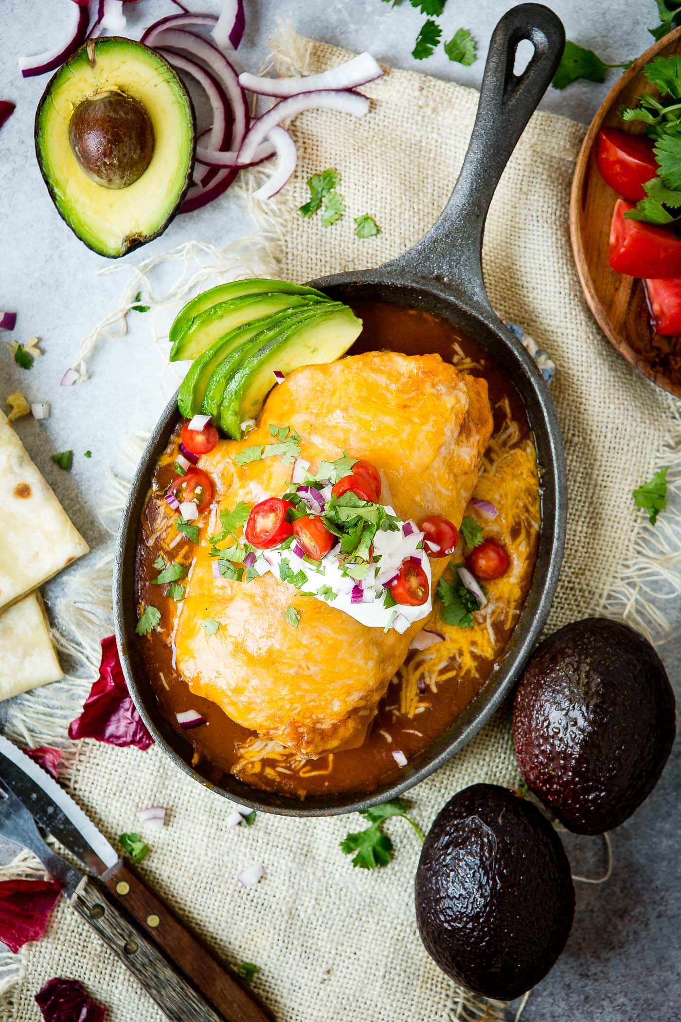 A cast iron skillet full of cheesy goodness, rich red sauce, and that irresistible baked-in flavor you can only get from the oven.